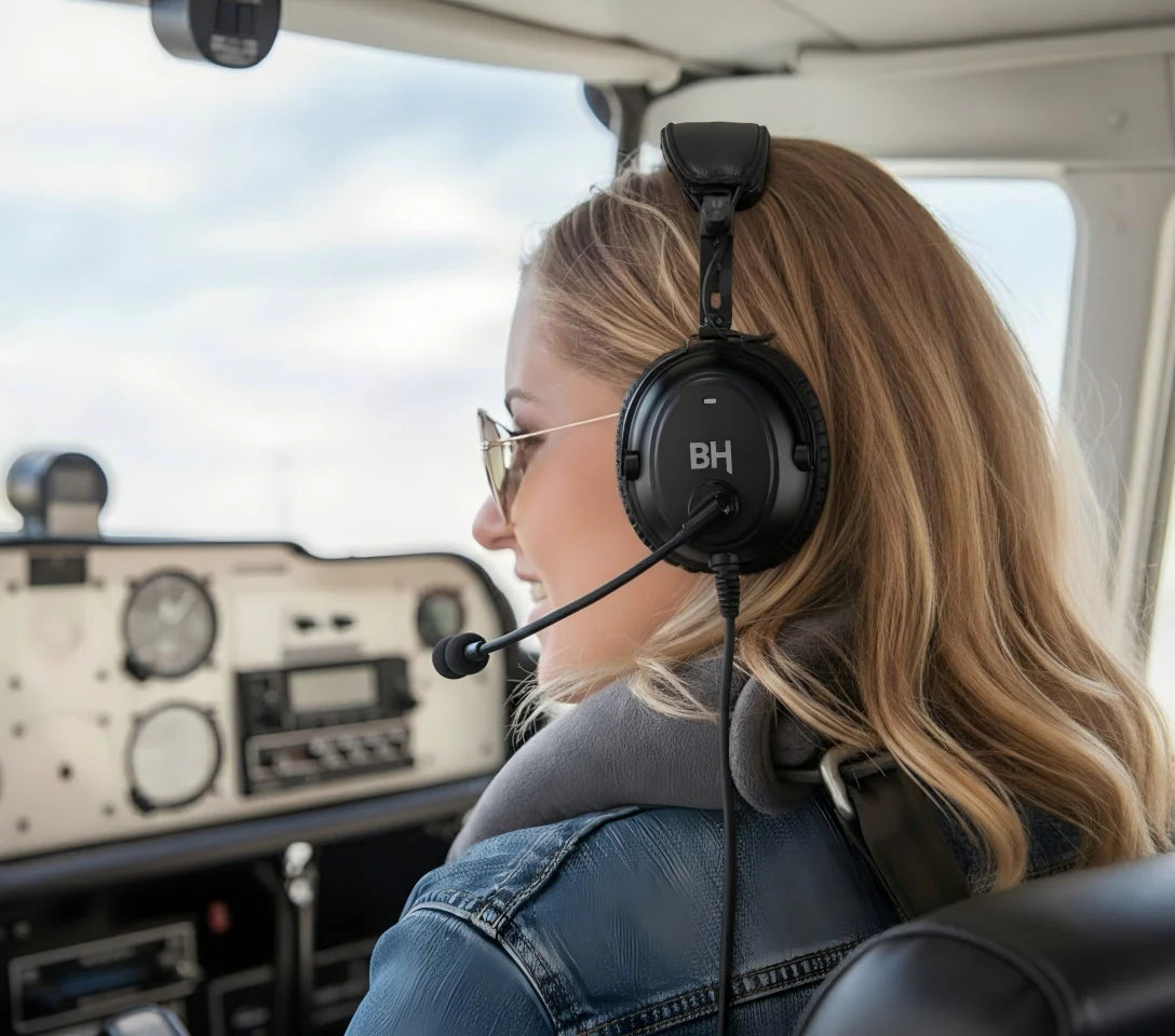 The female pilot is flying with BH Alpha Bluetooth Aviation Headset