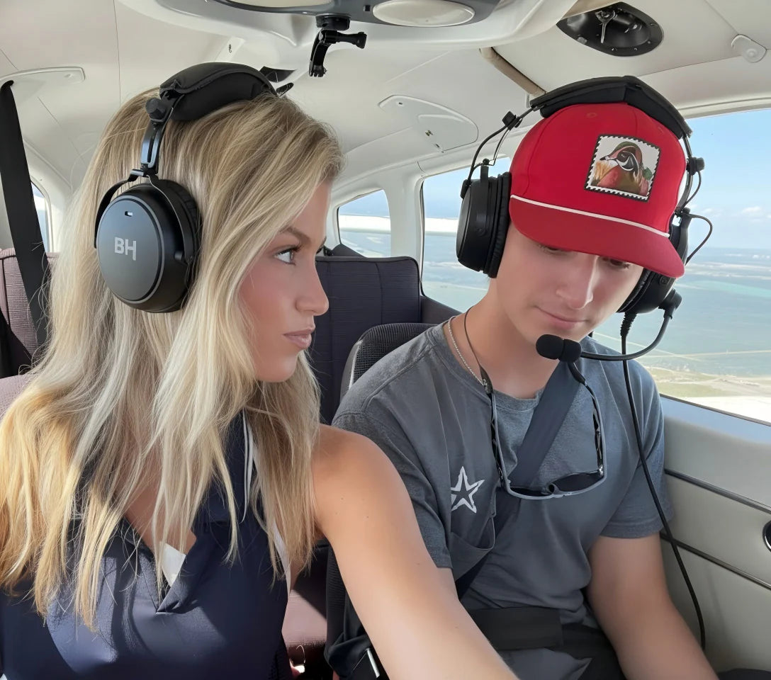 The student pilot is flying with BH Alpha ANR Aviation Headset