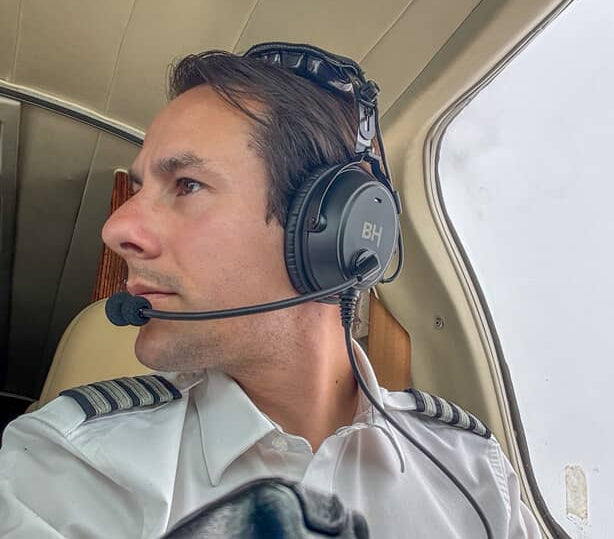 Pilot wears the Alpha Aviation Headset