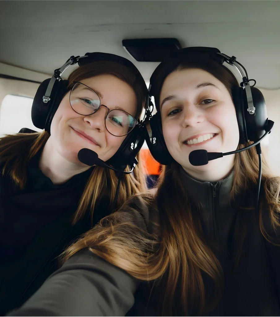 Two girls wear the BH Aviation Durable Pilot Headset