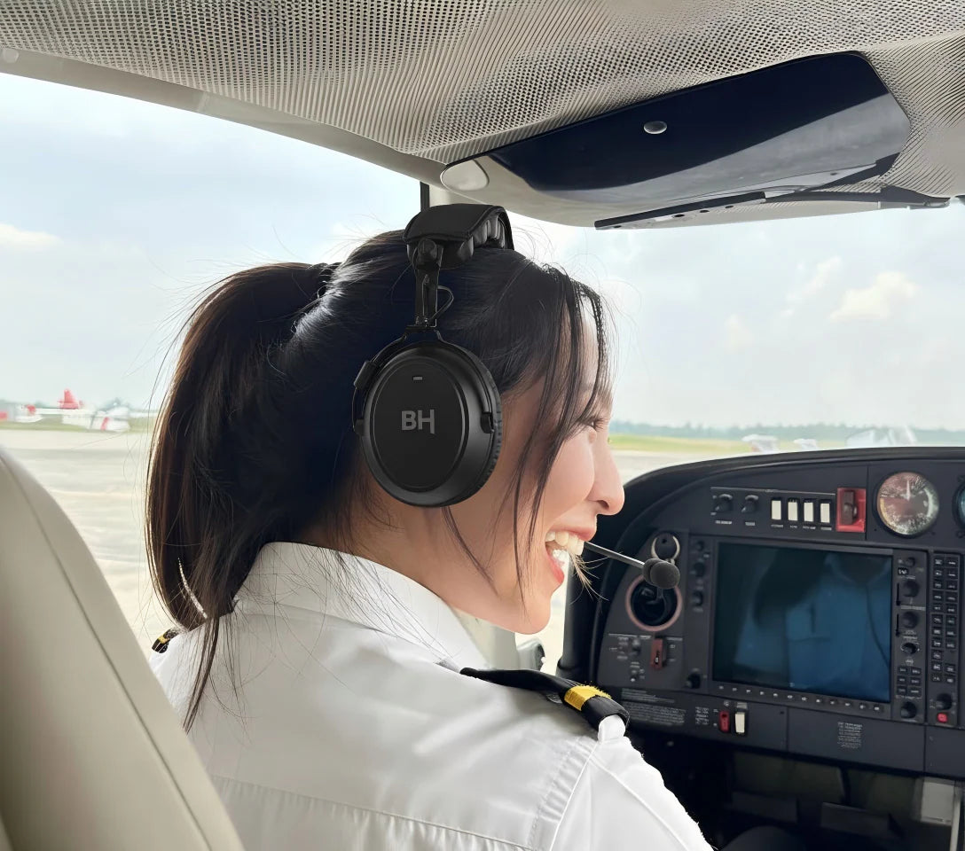 A professional pilot wears the BH aviation headset
